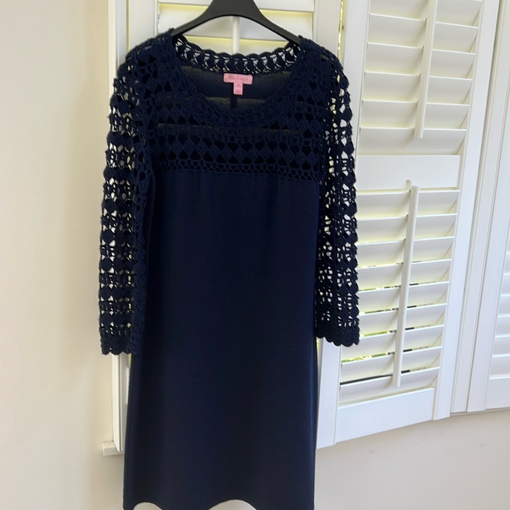 100% Marino wool Lily sweater dress with many details as seen in picture.